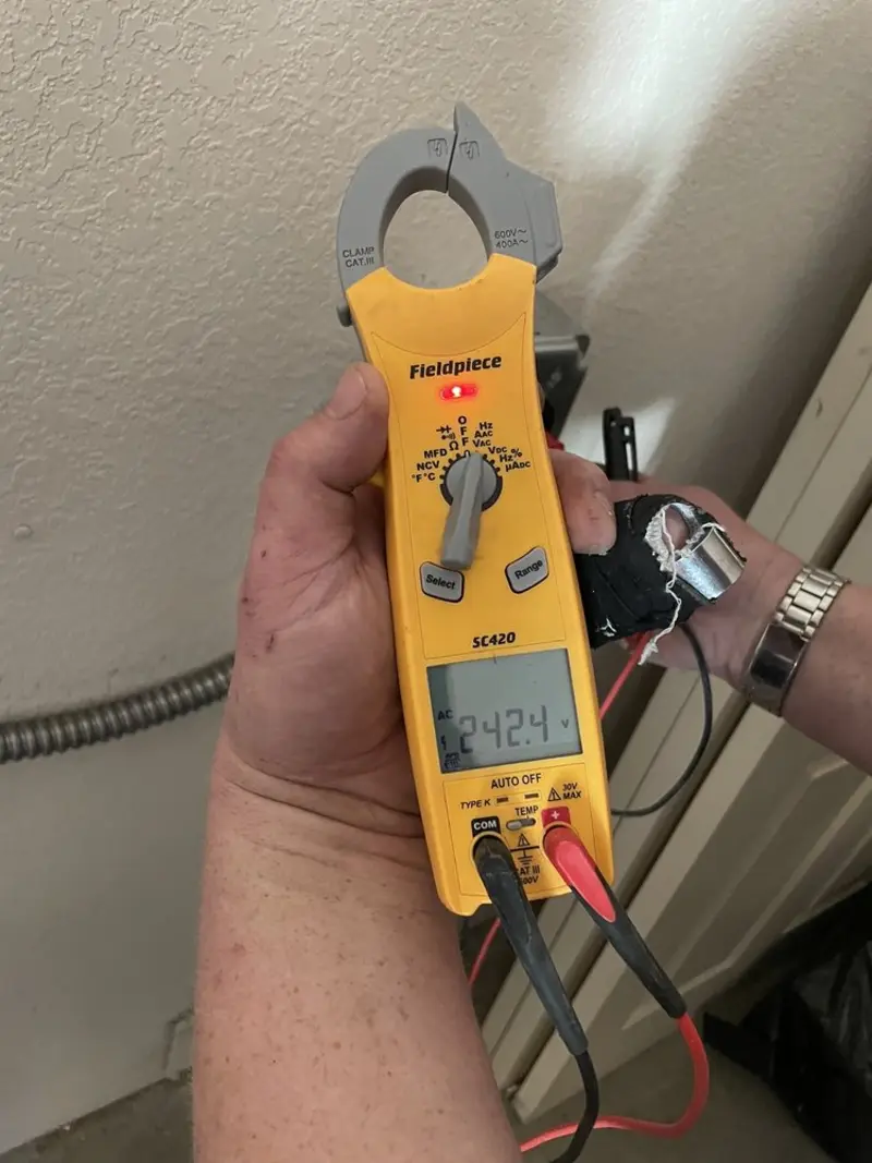 Voltage testing with clamp meter during Circuit Breaker Repair in Plainview